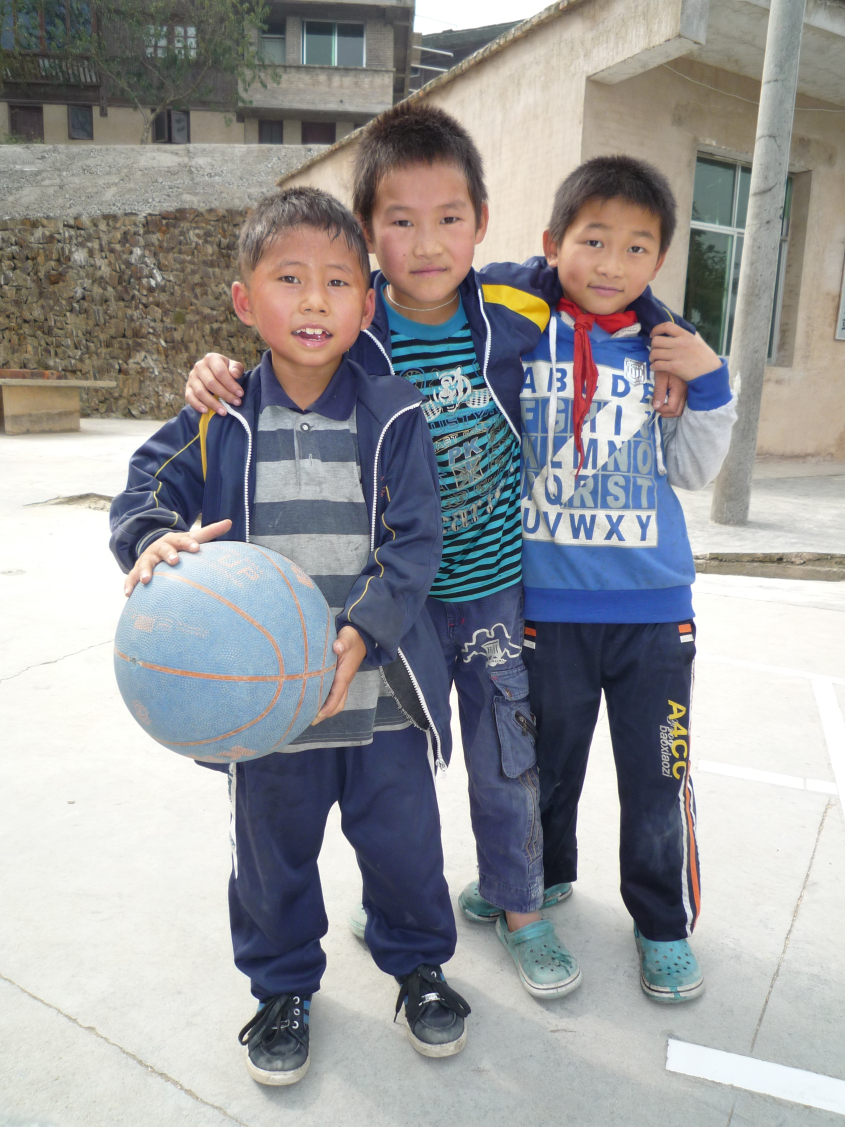 Chinese children playing with a ball